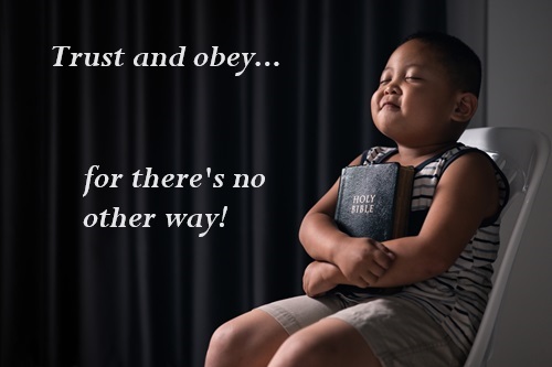 Boy hugging Bible